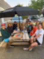 smiling runners at picnic table