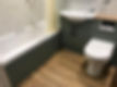 Sage green newly installed bathroom