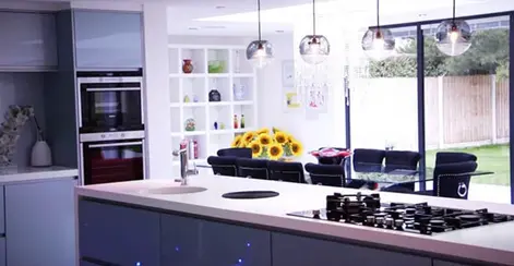 a very bright image of a large modern kitchen