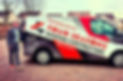 Four Seasons Roofing Contractors van with a man standing next to it