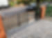 Black gate with a black car outside
