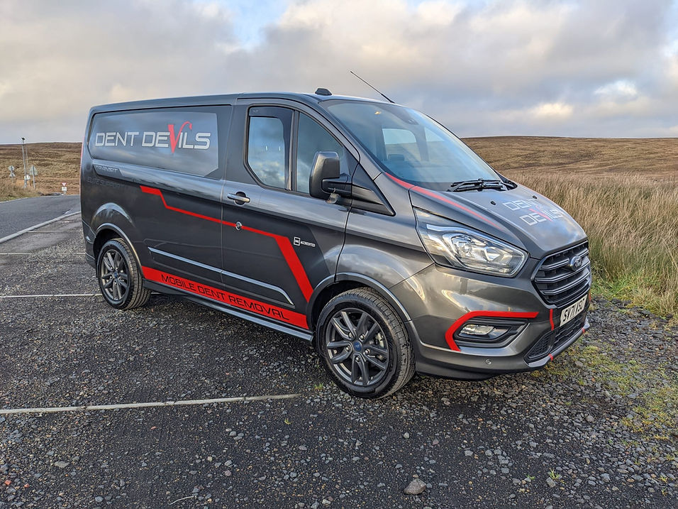 Dent Devils - a parked van