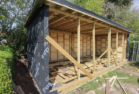 An outdoor building being made
