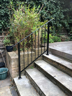 Black railing on stairs
