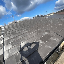 A view of a property's roof needing services.