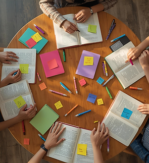 A tidy desk with a planner labeled “Grade 8 Prep,” colorful sticky notes, a laptop showing