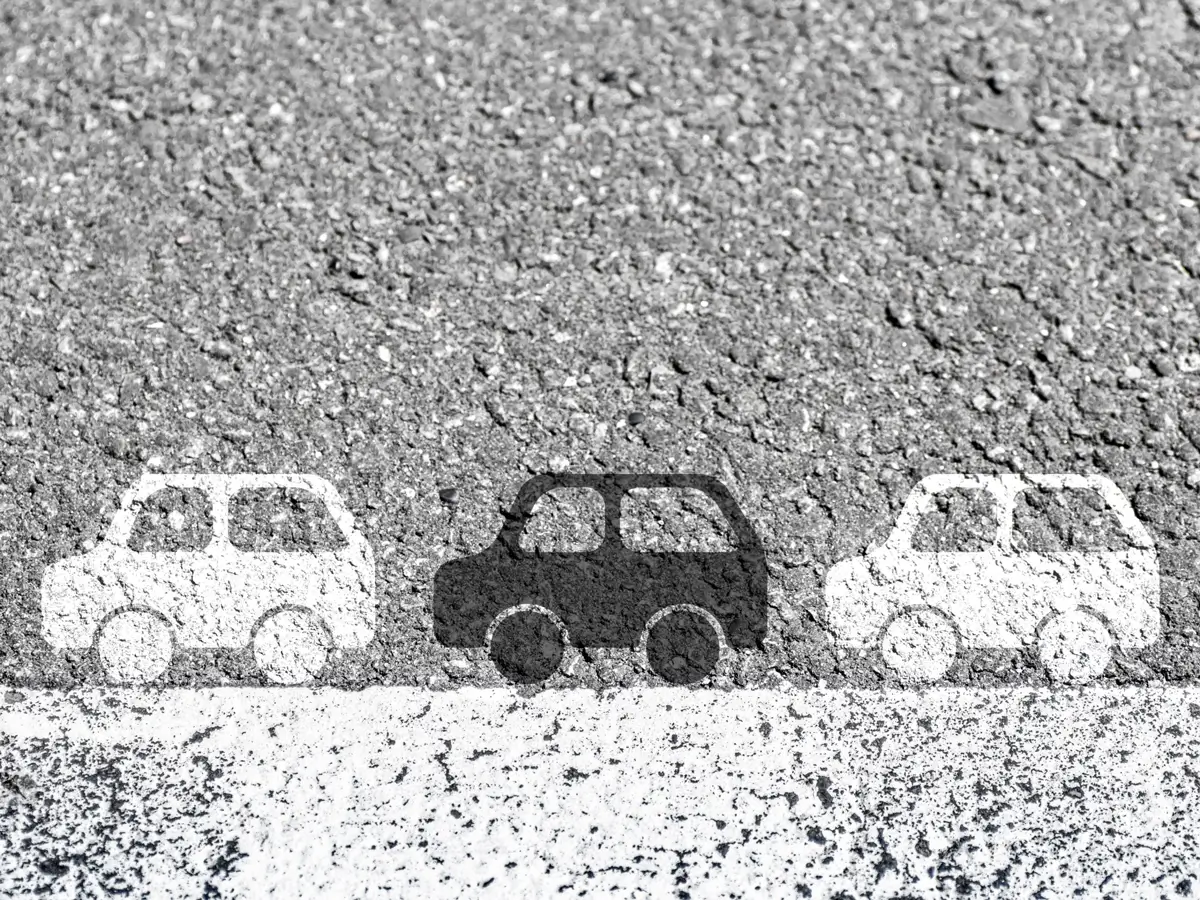 Cars line up on the white line