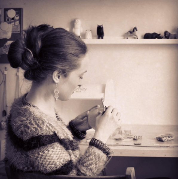Artist in her jewellery studio