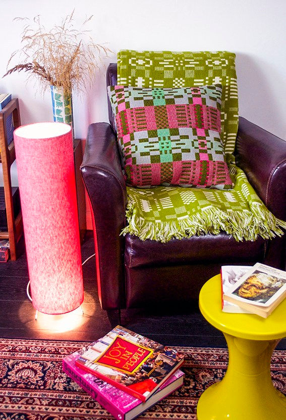 Floor lamp next to cosy armchair