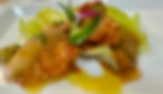 Close-up view of a gourmet seafood platter with vibrant colors and artistic plating