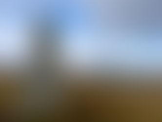 Three of the Callanais Standing Stones on the Isle of Lewis, with a misty, atmospheric backdrop that evokes ancient stone circle mythology.