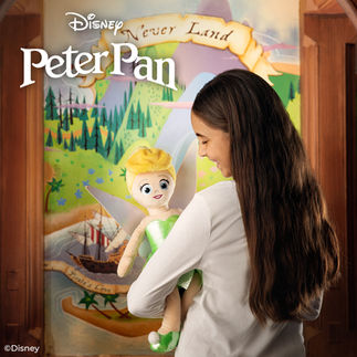 Young girl holding Tinker Bell Scentsy Buddy