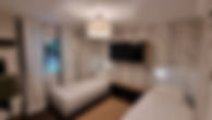 Bedroom 3 of A-84 vacation home with two single beds, wardrobe, and window with curtains