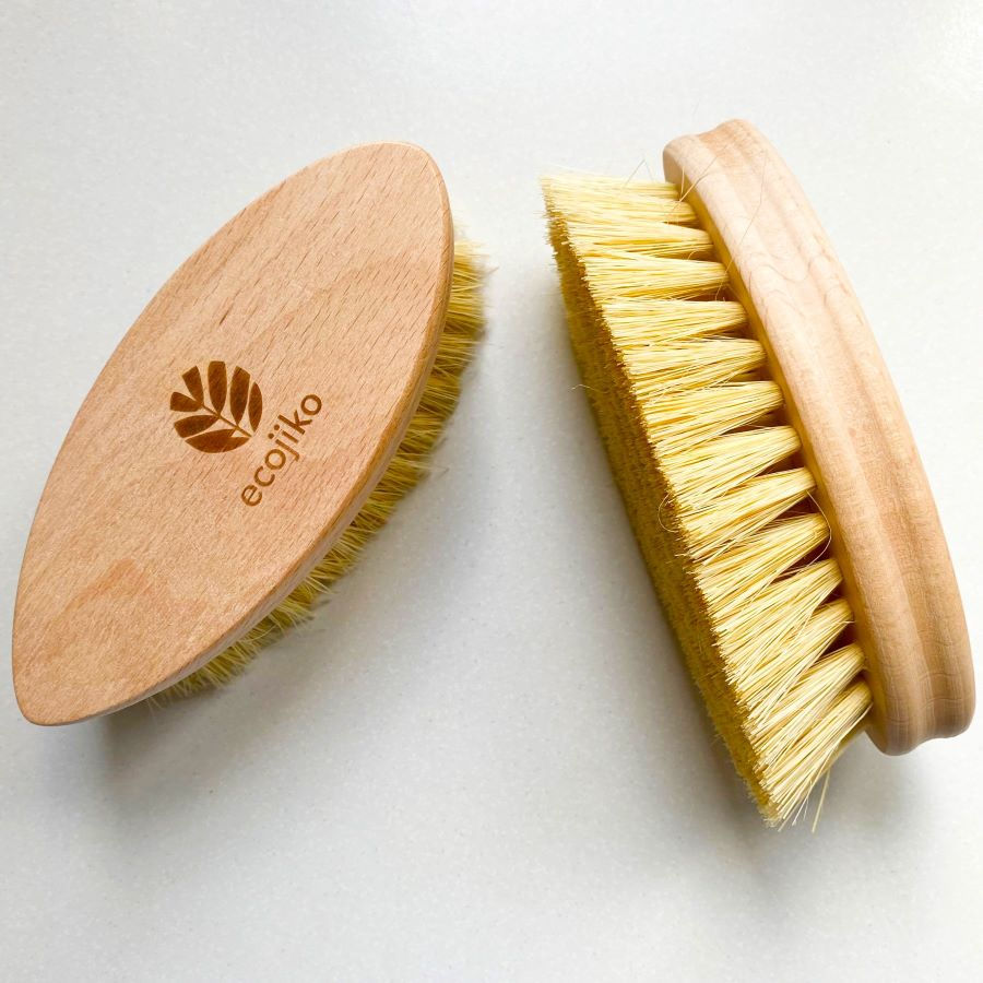 Thumbnail: Side and top view of an eco-friendly scrubbing brush with a wooden back and sisal bristles