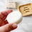 Thumbnail: Hand holding a white solid conditioner bar with a soap dish in the background