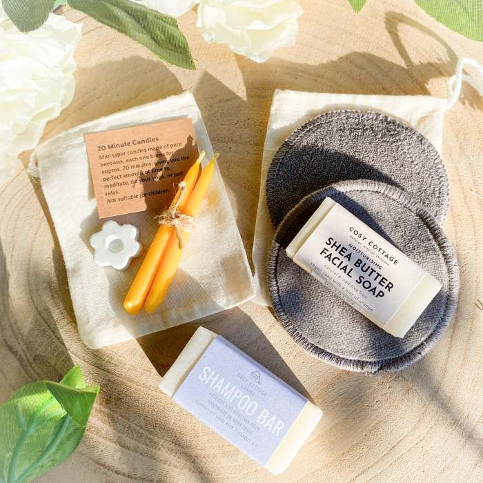 Contents of a selection pack of sustainable self-care products arranged on a table