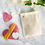 Thumbnail: Set of mini relaxation candles resting on a pink heart with a another mini relaxation candle set in its storage bag alongside