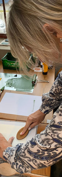 Woman using baren to print