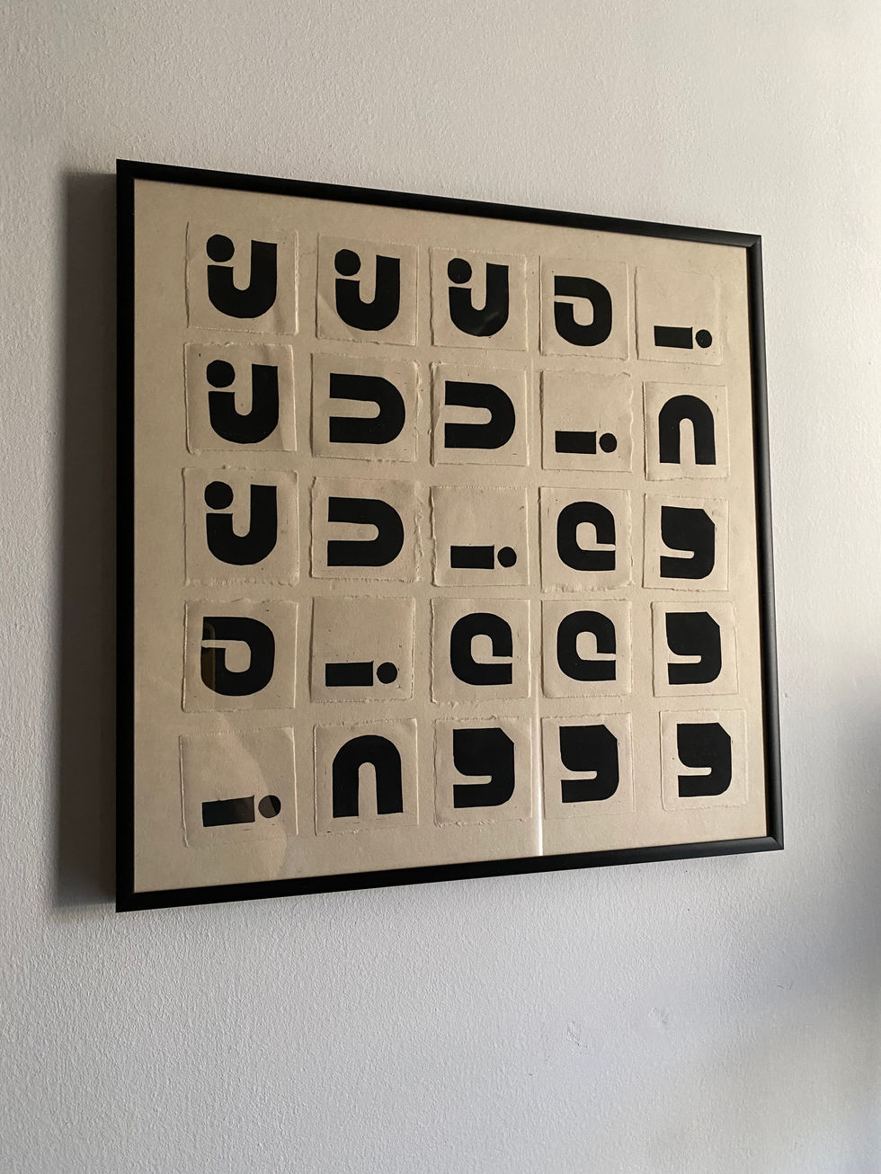 a mosaic of small linocut prints with the letters J U I C Y 