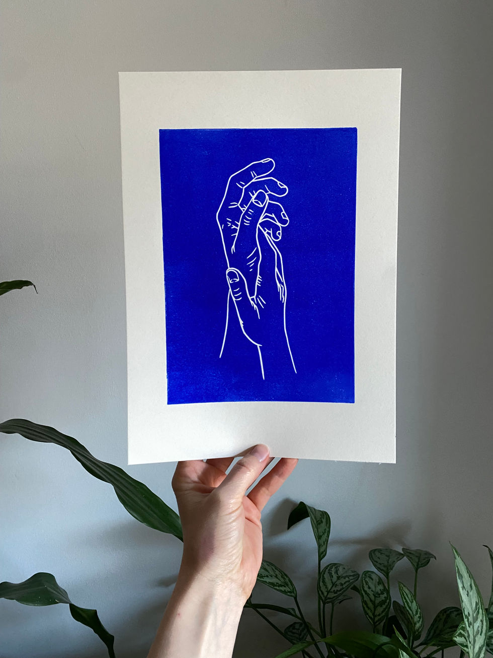 blue linocut print of two hands