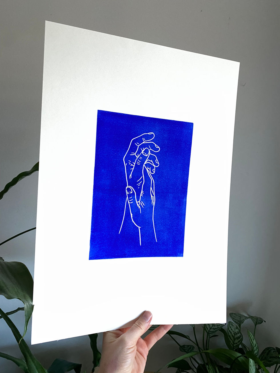 blue linocut print of two hands