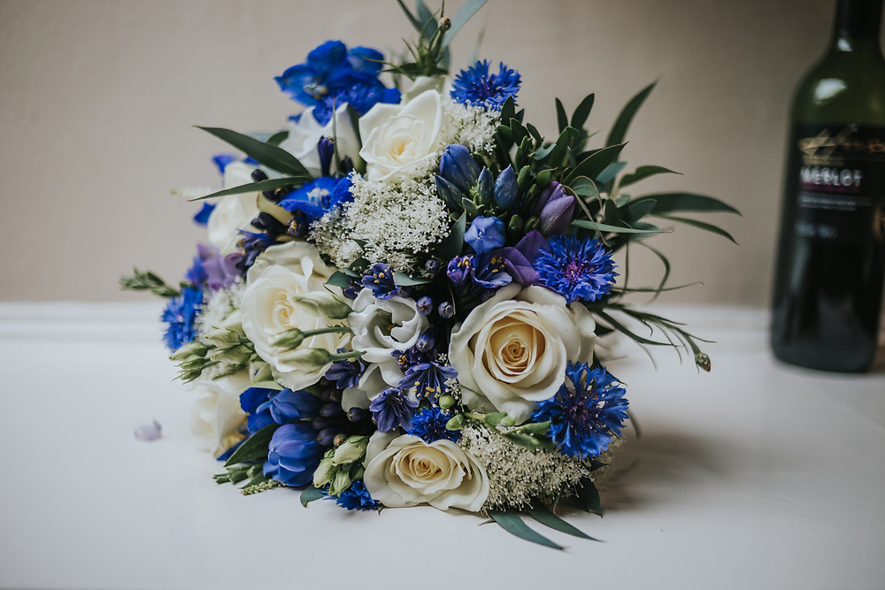 Brides blue and white bouquet on a table