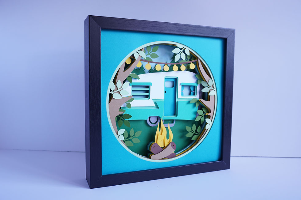 Thumbnail: Black framed 3D shadow box of a vintage camper