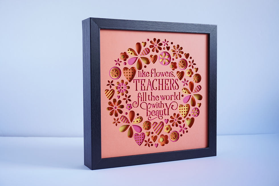Thumbnail: Black framed 3D shadow box in oranges, pinks and red with a sentiment about teachers