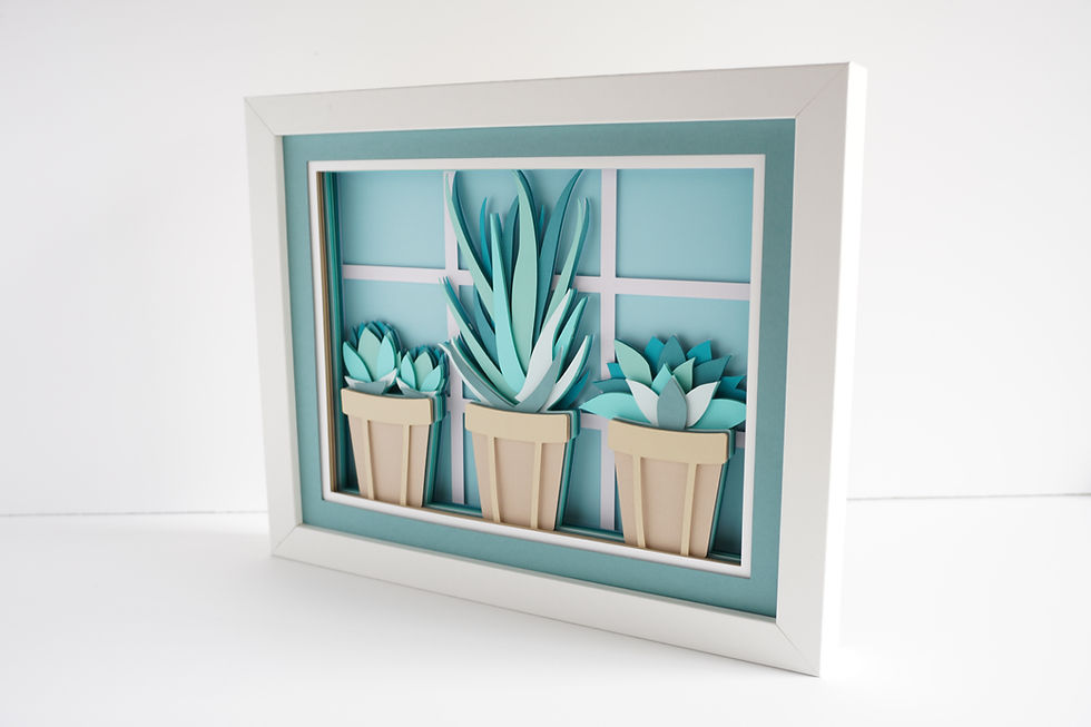 Thumbnail: White framed 3d shadow box of potted succulents