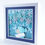 Thumbnail: White framed 3d shadow box of child catching snowflakes on tongue in shades of blue and silver