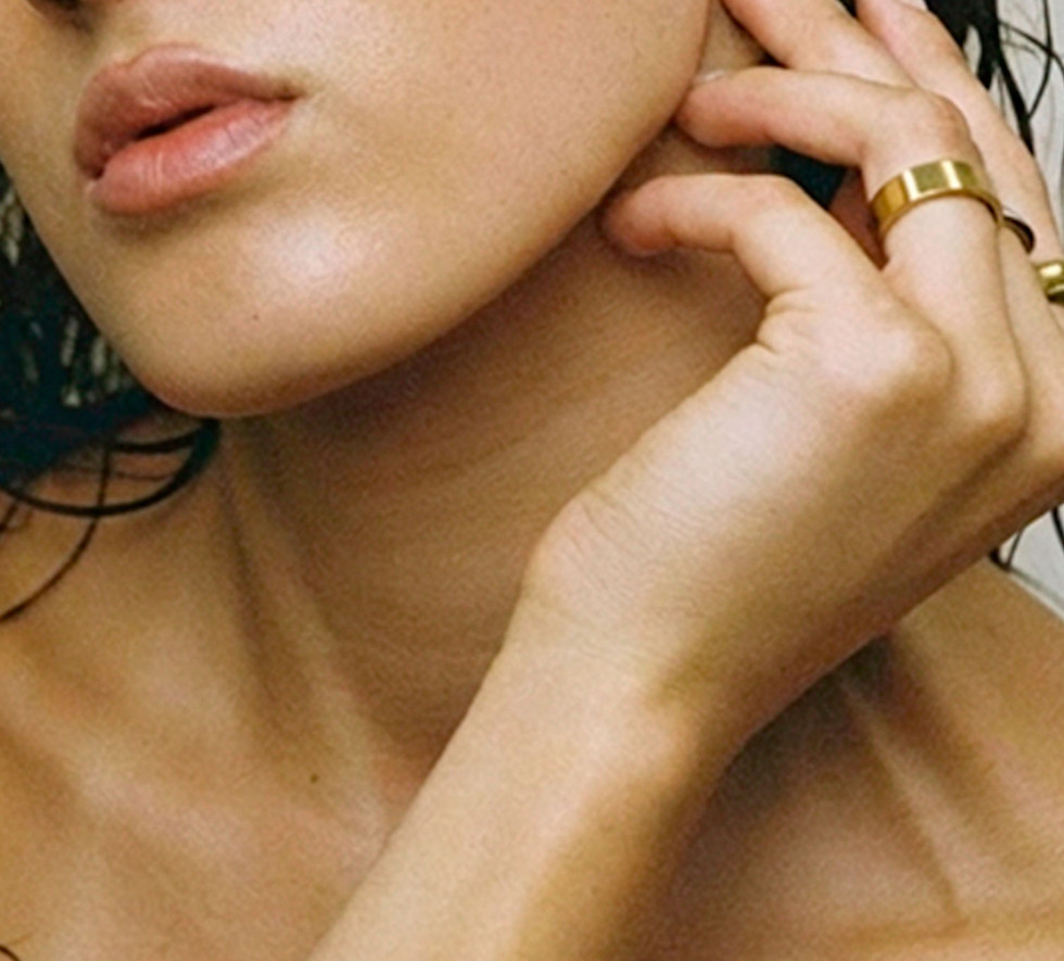 Woman touching face with clear radiant skin