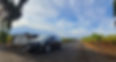 Chauffeured Cadillac Sedan next to a vineyard in Amador
