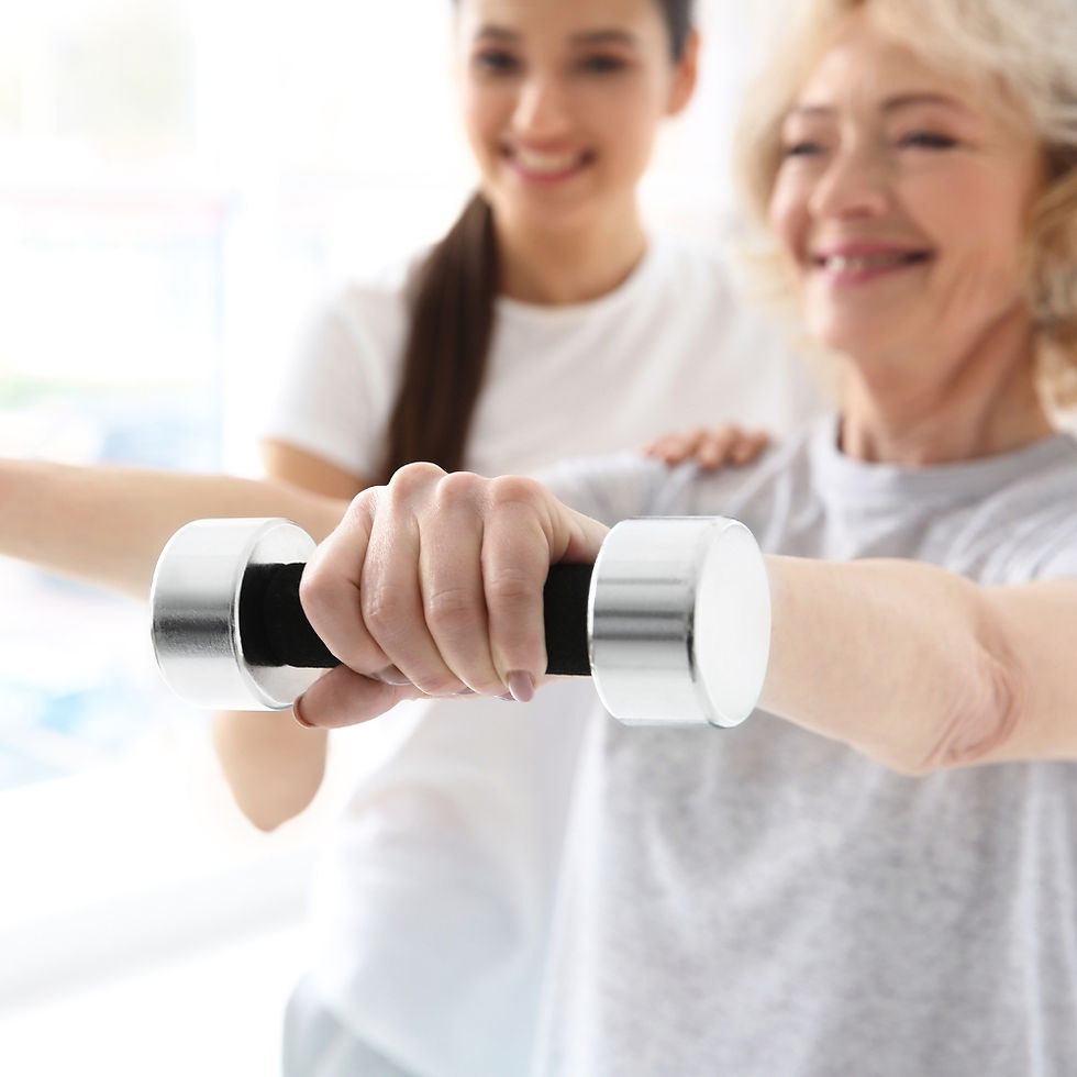 A mature female is being shown how to perform strengthening exercises.