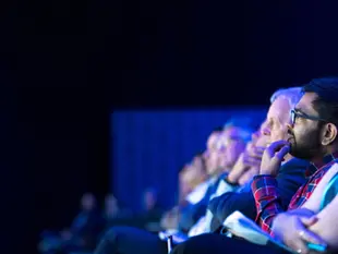 Audience listening at a conference
