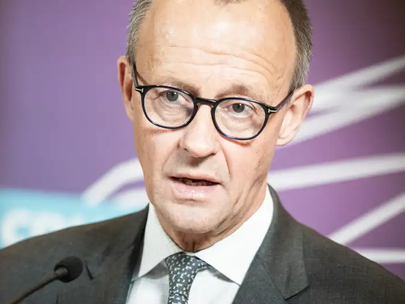 German opposition head Merz hails EU migration deal in Paris