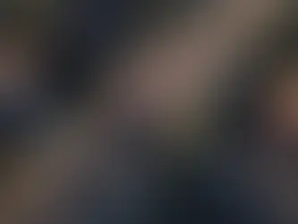 Realistic aerial view of a police chase in suburban Los Angeles neighborhood, near White Oak Avenue and Oxnard Street in Tarzana one dark-colored sedan speeding through intersections, pursued by multiple LAPD vehicles with flashing lights, dramatic motion blur, late afternoon lighting, palm trees and residential homes lining the streets, news helicopter angle, cinematic tension, no signage or license plates