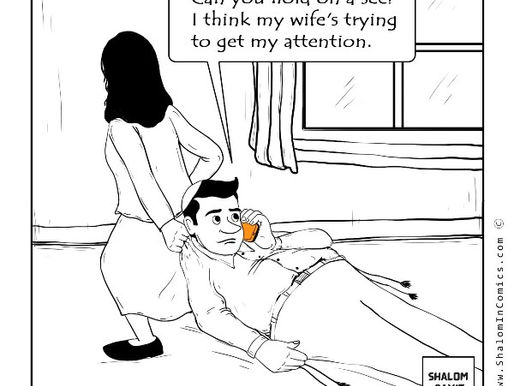 Cartoon of a man lying on the floor, casually talking on the phone while his wife stands behind him, gripping him by the ear. The man says, “Can you hold on a sec? I think my wife’s trying to get my attention.” The image is tagged with “Shalom Bayit” and comes from ShalomInComics.com. The scene humorously highlights a lack of attentiveness in relationships.