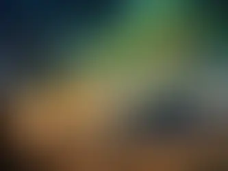 A fantastical landscape featuring a towering, vibrant mountain with swirling green and gold hues under a starry night sky, illuminated by a radiant peak. In the foreground, a barren tree frames two silhouetted figures, an adult and a child, standing on a rocky path overlooking a glowing city below. Butterflies and distant figures add a mystical, dreamlike quality to the scene.