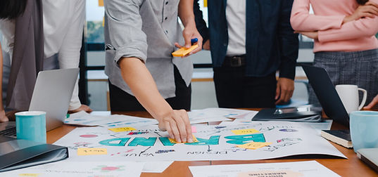 happy-young-asian-businessmen-businesswomen-meeting-brainstorming-ideas-about-new-paperwor
