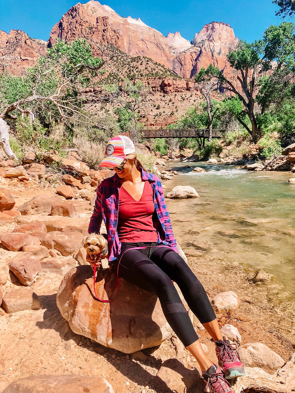 Outdoorsy woman hiking in california with her dog