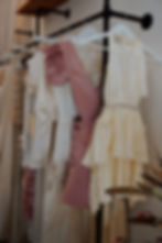 luxury aprons hanging; luxury aprons; gift; cooking; baking; fashion; home goods; bridal gift; white apron