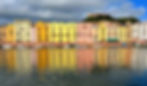 Colourful riverside houses reflected in the Temo River in the historic town of Bosa, Sardinia.