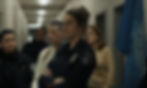 Shailene Woodley in a police uniform, crossing her arms