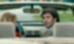 Sophie Nélisse and Adam Brody in a convertible