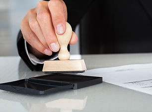 Hand pressing a stamper into ink pad