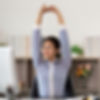 woman stretching to prevent back pain