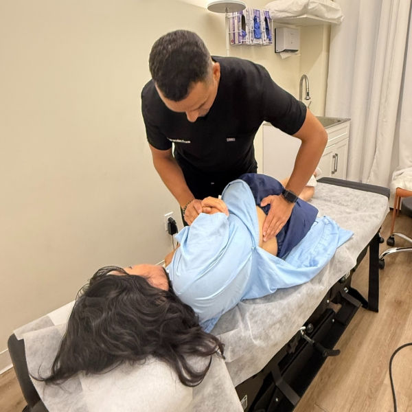 chiropractor performing spinal adjustment