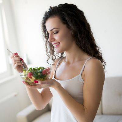 woman consuming a nutritious, healthy meal
