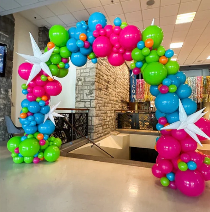 A beautiful elaborate balloon arch with many colors