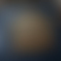 Blue leather book with ornate gold emblem: "Ultimate CBSE Class 12 English Study Guide." Pens and books in a library setting.